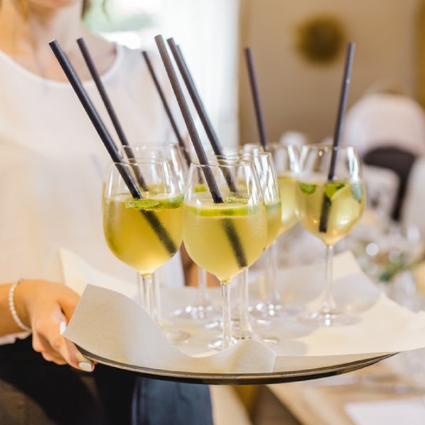 waitress serving signature drinks for wedding